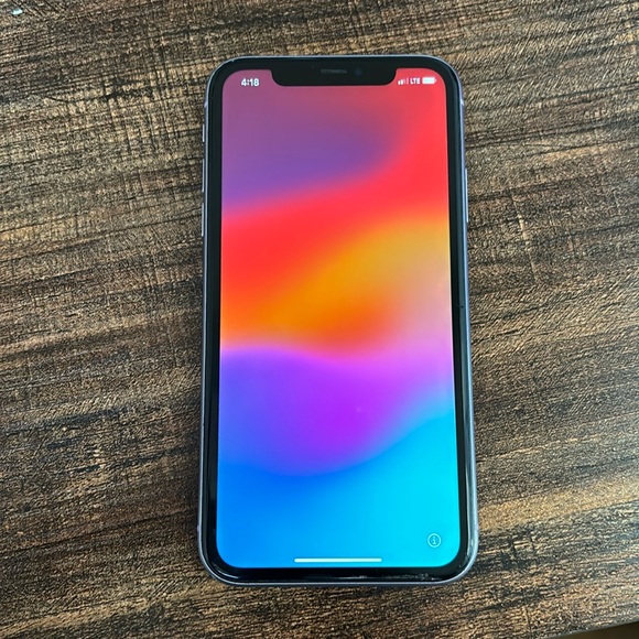 Used iPhone 11. Purple. Has a tiny scratch on the bottom of the screen